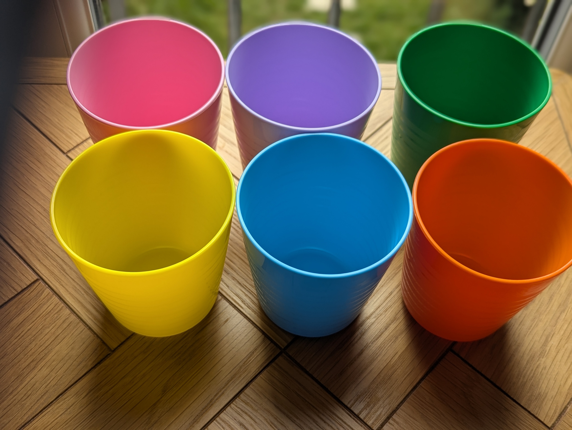 Six colourful reusable cups