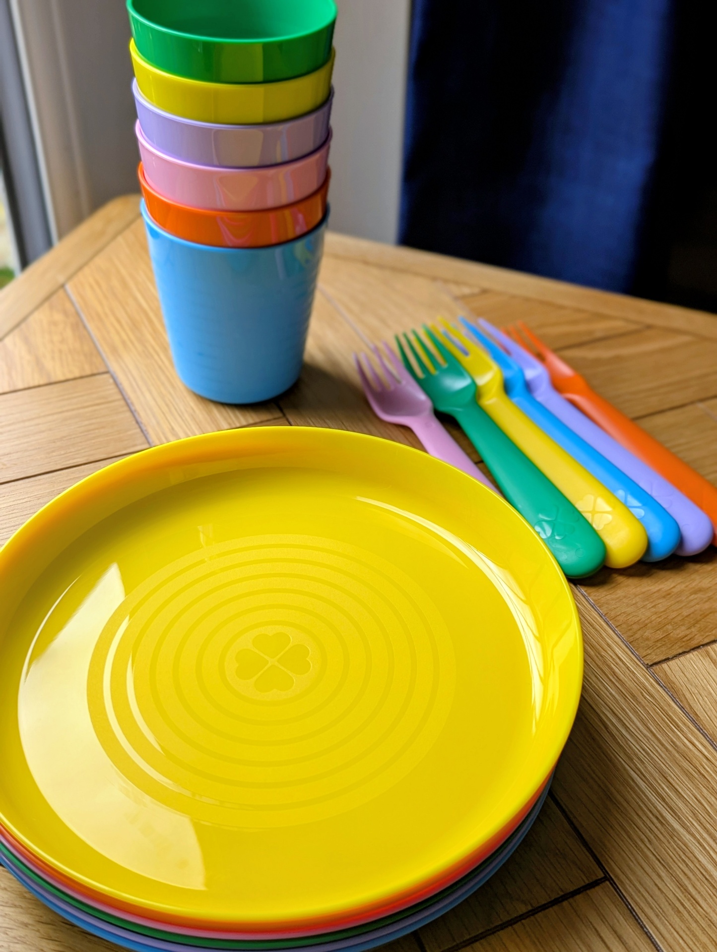 Stacked plates, cups and forks